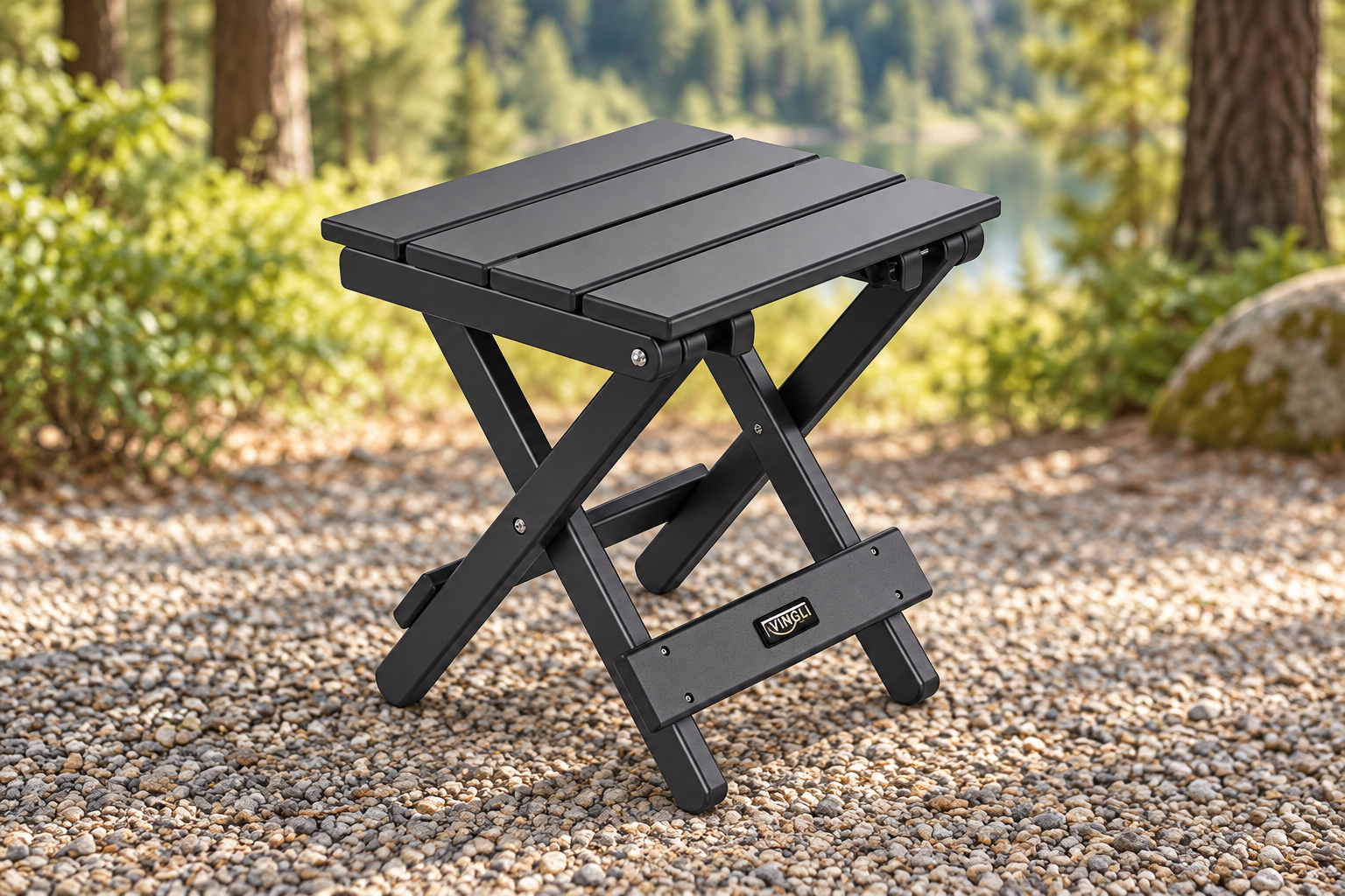 Black slatted folding side table in a styled wooded campground setting