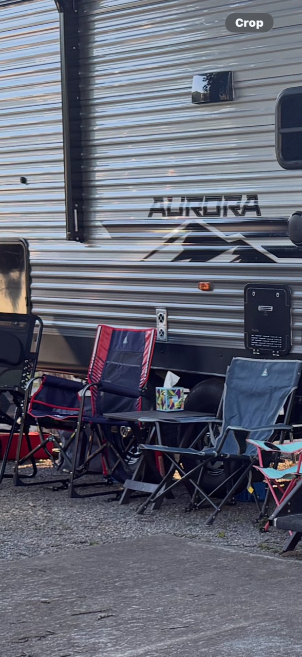 Our taller red-and-dark chair and lower blue chair arranged beside the Aurora