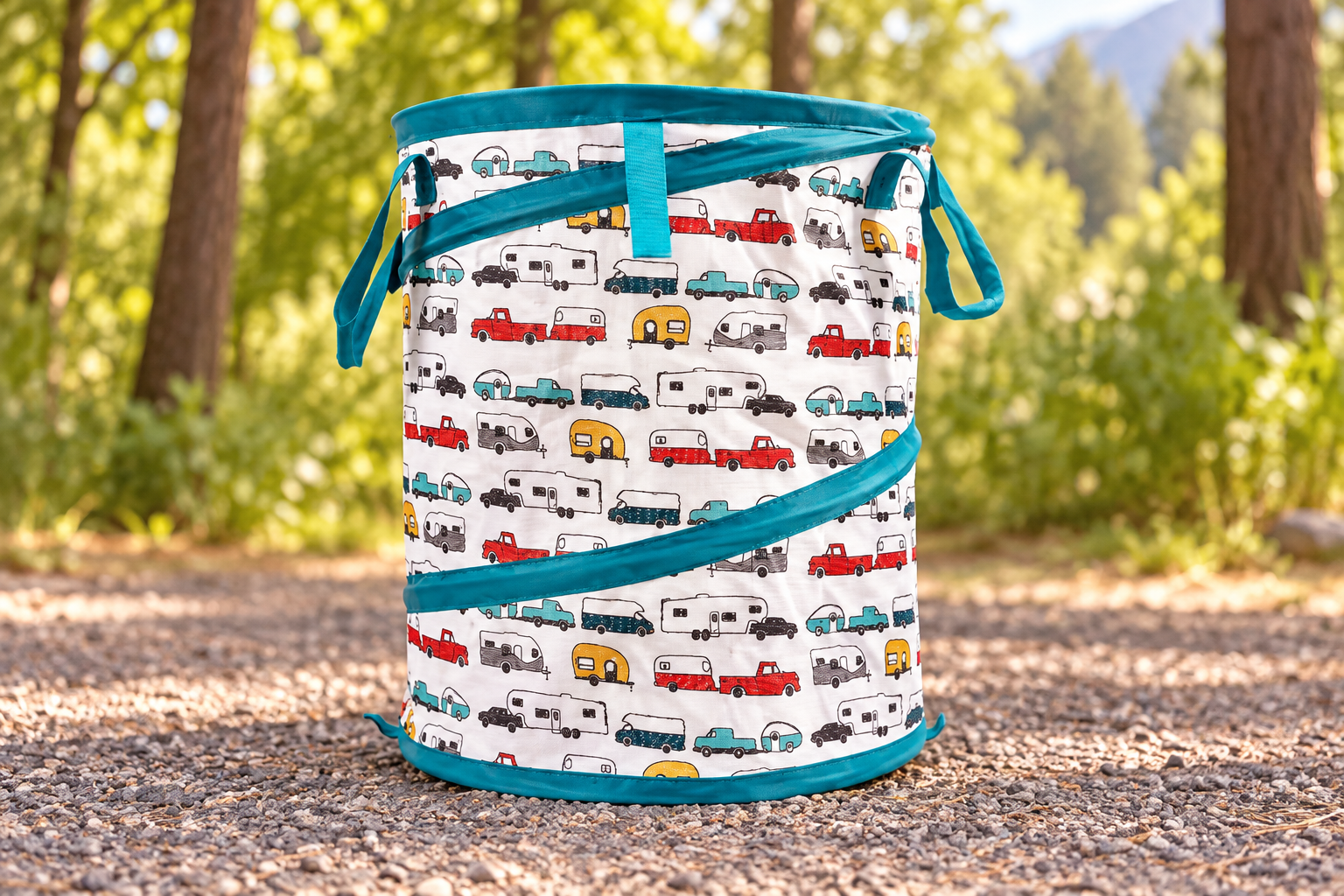 Teal-trimmed camper-pattern pop-up container in a styled campground setting