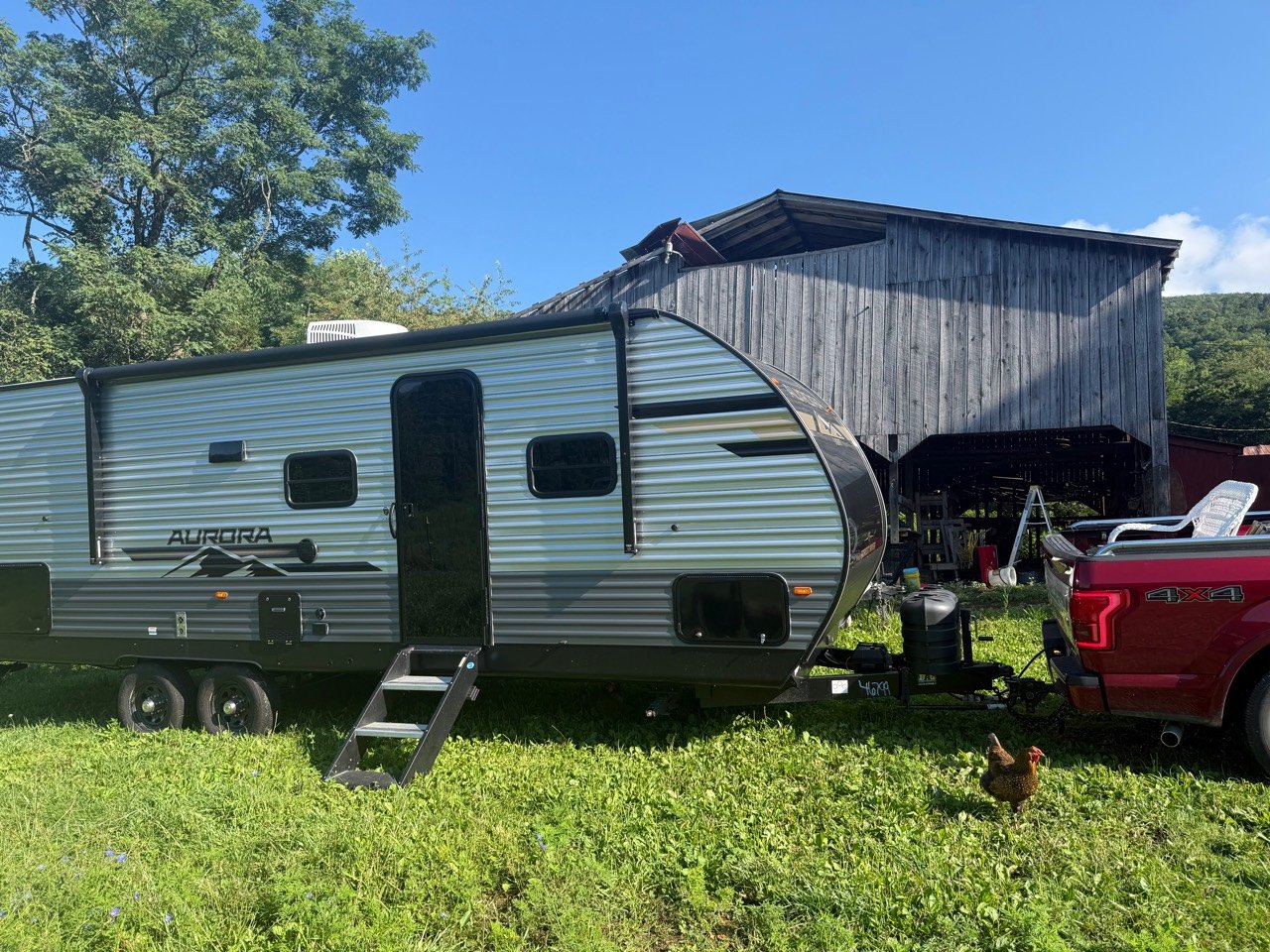 The Aurora Light 26BHS hitched to our Ford F-150 at home