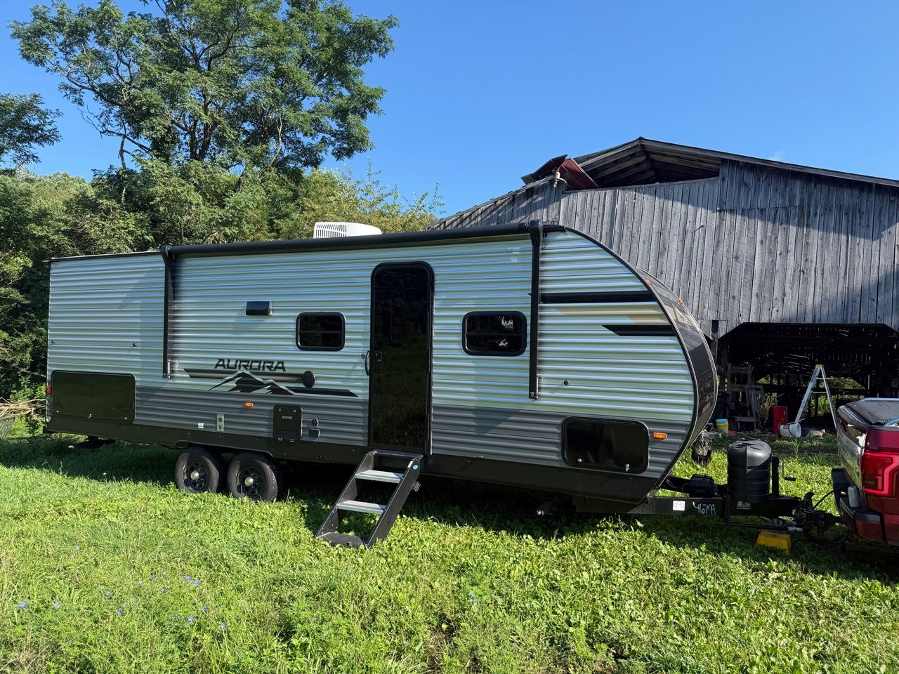Our 2026 Forest River Aurora Light 26BHS travel trailer parked at home
