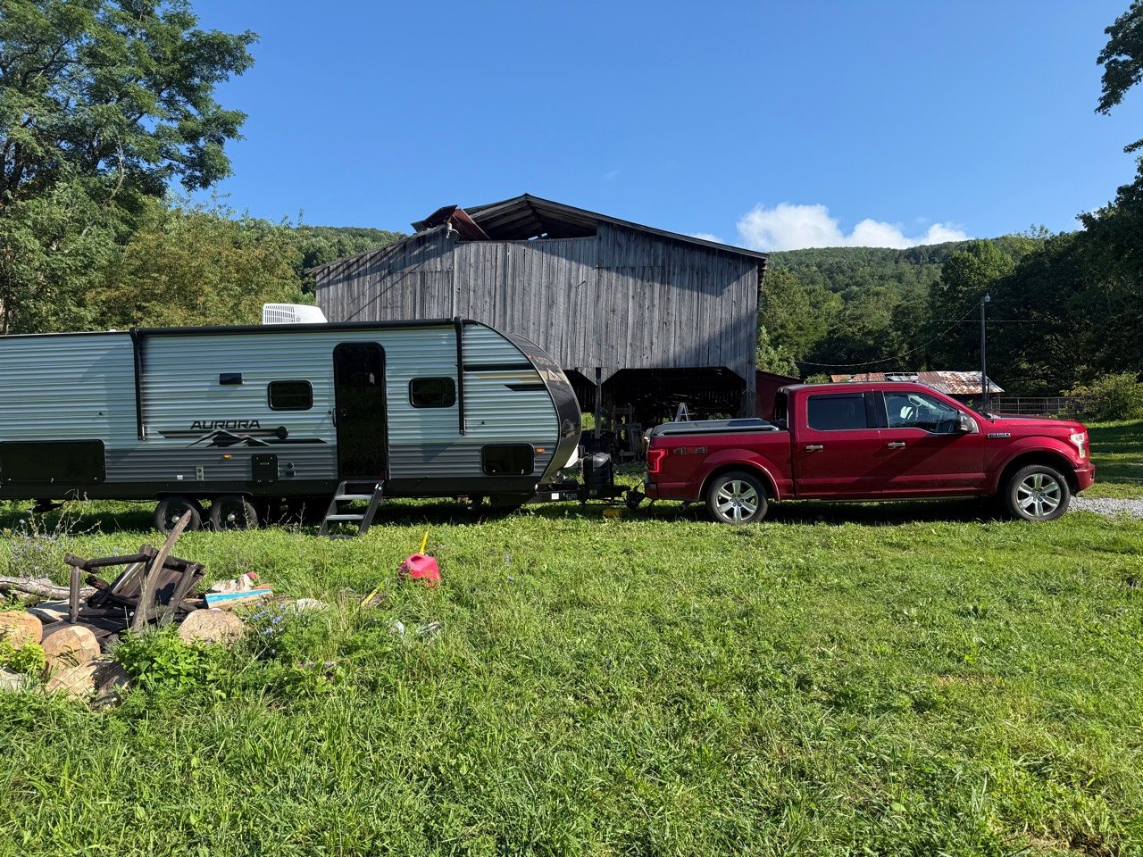 The RV Fam Adventure truck and Aurora travel trailer ready for a departure check