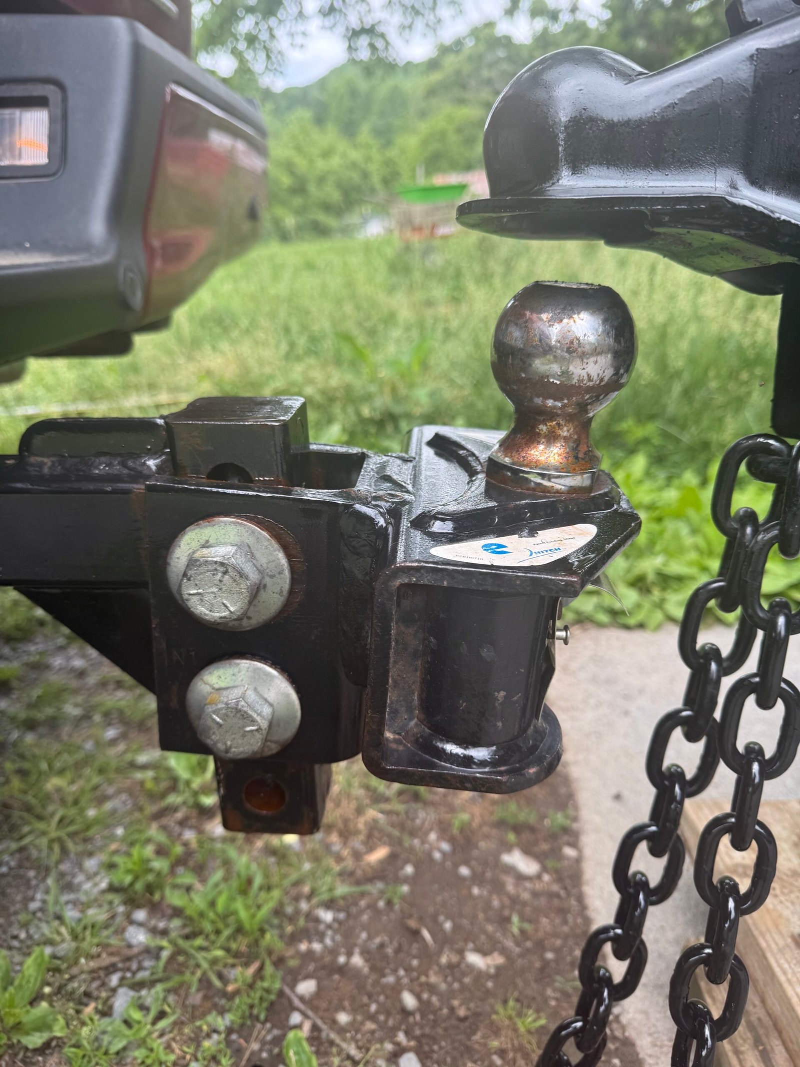 Close view of the family travel trailer coupler and hitch connection.