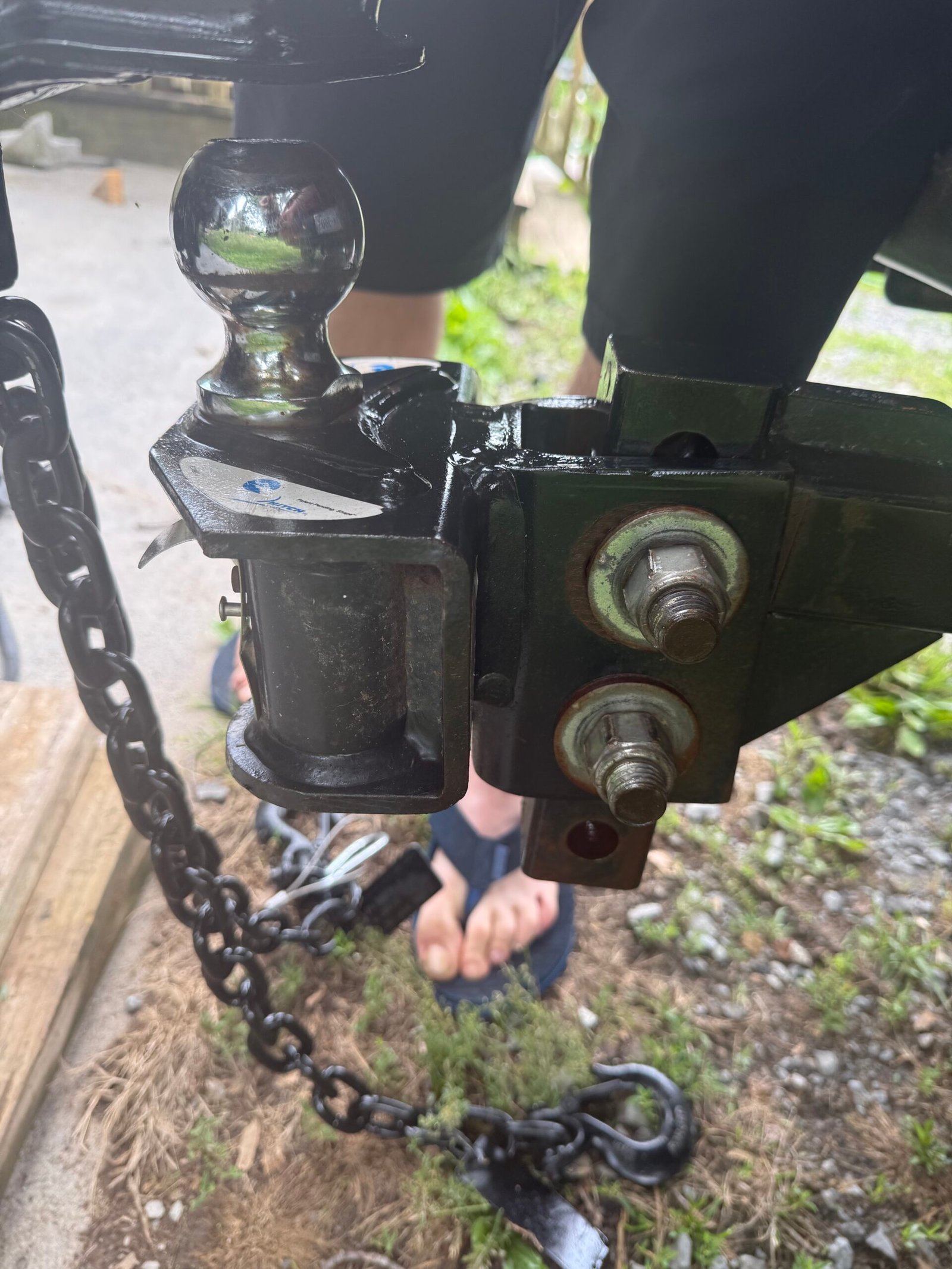 Detailed view of the weight-distribution hitch and coupler area.